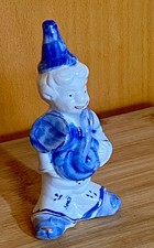 Figur Clown mit Instrument aus