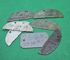 7 Erkennungsmarken. Bodenfund