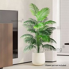 Große künstliche Palme groß gefälschte Pflanzen tropische Plastikblätter.