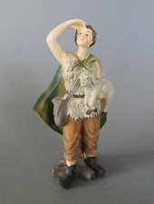 Hirte schauend mit Schaf für