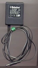 - Netzteil US Robotics, rein 230 V ~, raus 9 V ~ (faktisch 11,5 V ~), 1 A
