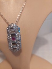  Anhänger + KETTE.18 Kt Weissgold. 18 Diamant 1.4 Kt 1 Rubin 1 Kt