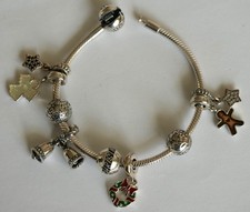 PANDORA Silberarmband (18cm) + 7 Weihnachts-Charms + 2 Clips