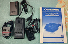 Olympus Ladegerät VF-BA86-E + Fernbedienung VF-RM9 + Handbuch VX-82-KE + Adapter