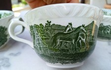 1  schön geformte Tasse