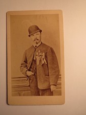 standing man with beard hat