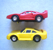 Slotcar Ferrari rot + Porsche gelb 1:43 ??? mit Lichtfunktion Sammlungsauflösung