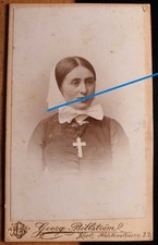 Woman with headscarf & cross -