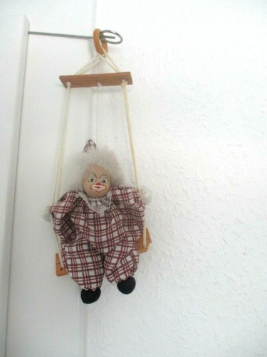 Clown auf schaukel sitzend - schaukel,