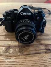 Canon A1 Analog Kamera mit 2 Objektiven und sonstigen Zubehör (Mecablitz 40 ct4)