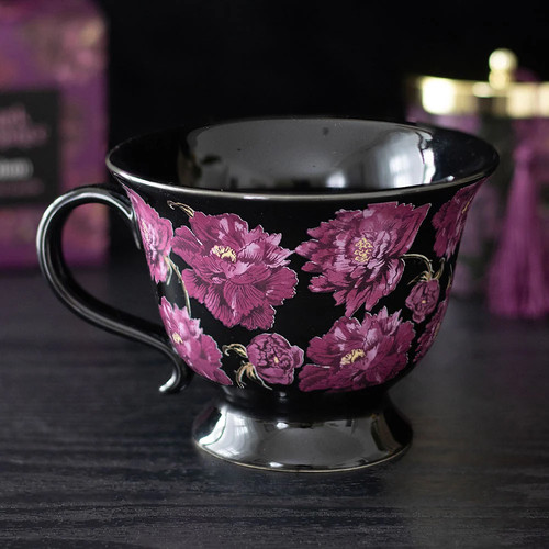 Schwarze tasse mit blumendekor - schwarze,
