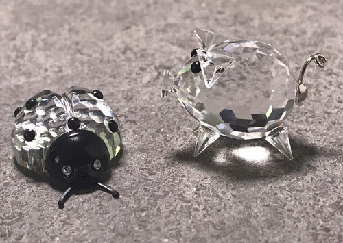 Zwei glücksbringer swarovski - glücksbringer,