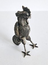 Stilisierter Hahn Silber um