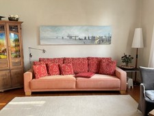 Sofa von der Firma Kauffeldt aus Bielefeld, Orange, hellrot, Kissen mit Muster