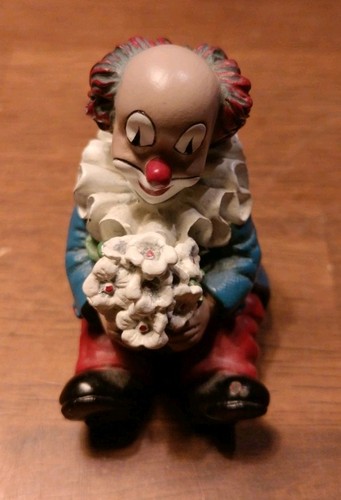 Gilde clowns figur sitzend - figur, mit
