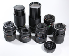 Konvolut mit 7 Objektiven für Canon FD, defekt für Bastler