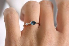 Oval topaz gold ring blue