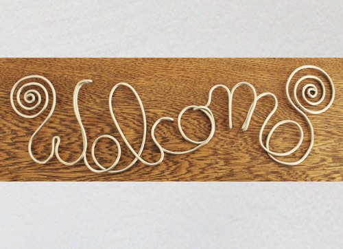 Gebogener schriftzug welcome - schriftzug,