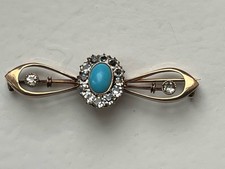 Schöne alte Brosche mit türkisfarbenem Stein und 12 kleinen Steinen 333er Gold