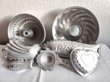 ein Konvolut Alu - Backformen & Puddingformen , Konfektschalen
