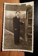 standing boy in suit with