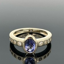 RING GR.16 (CA.50) 375/-GELBGOLD MIT TANSANIT & ZIRKON SCHMUCKJAGD