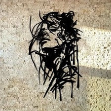 Frauengesicht Metall