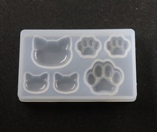 Katzen Köpfe und Pfoten