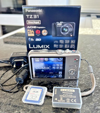 Panasonic LUMIX DMC-TZ31 14,1 MP Digitalkamera Silber + Ledertasche + 2. Akku