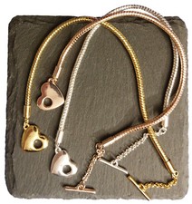 Charms,  silbern, golden rosé