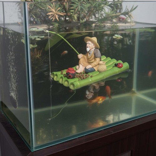 Fischerfigur auf bambusfloß - auf,