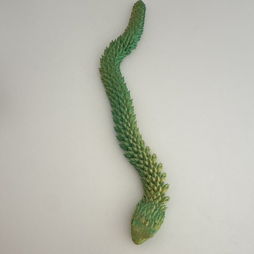 Grüne schlangenfigur - grüne,