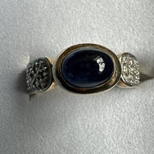Ring,Gg.585,Saphir Cabochon 8x6mm, 14 kl. Diamanten,Ringschiene 4-8mm, 5,4 Gramm