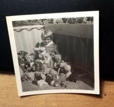 little girl with pile of toy