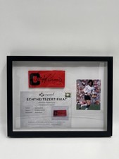 Kapitänsbinde Wolfgang Overath signiert im Rahmen DFB Fußball Autogramm COA