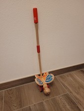 Hape Schmetterling Nachziehtier / Lauflernspielzeug aus Holz – bunt