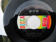 THE MERGING TRAFFIC Bit By Bit