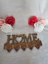 Schlüsselbrett in einem Antik-Rustikaler Optik und mit der Schrift Home, Resin