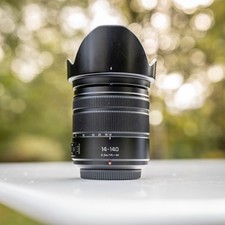 Lumix 14-140 f3.5 G Vario II Power OIS + OVP + Filter sehr gepflegt Zubehörpaket