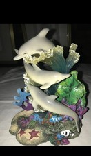 Korallenriff mit 3 Delphinen