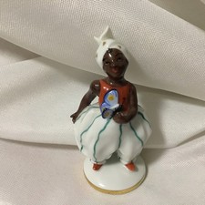 Porzellanfigur Kind mit