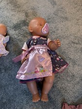 Baby Born Puppe mit Bett, Puppenwagen, Kleidung, Tragegurt und Babypuppe