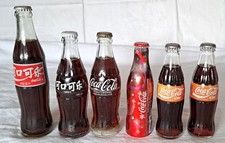 Auflösung:Nachlass-Fundzustand. Coca Cola Konvolut volle Flaschen-China,usw..