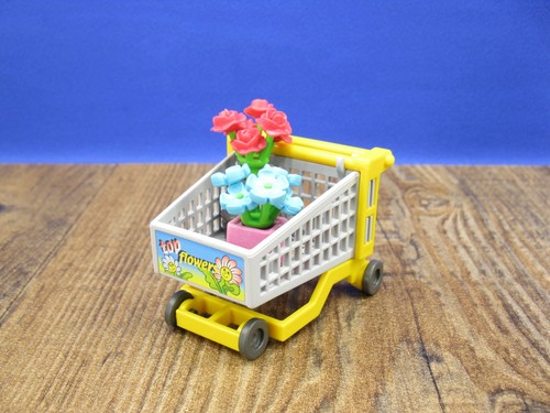 Einkaufswagen mit blumen - einkaufswagen,