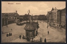 München, Bahnhofsplatz mit Kutschen und Straßenbahnen, Ansichtskarte 1915 