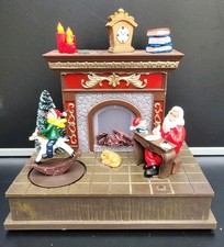 Spieluhr "Santa's am Kamin" mit LED Beleuchtung,  Timer und Bewegung. 