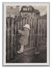 Child in Winter Coat at Garden