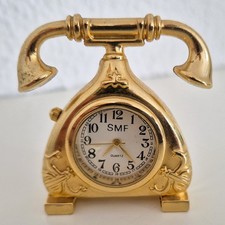 Miniatur Quarz Uhr im Telefon