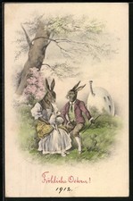 Osterhasen-Paar mit Lamm auf dem Schoß, Ansichtskarte 1912 