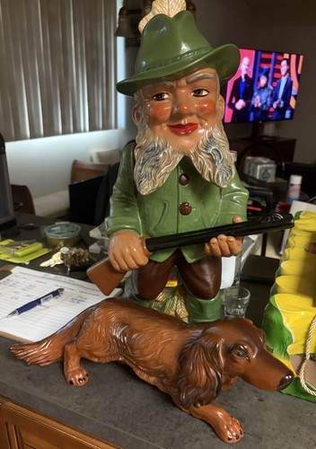 Gnome hunter with - dachshund,